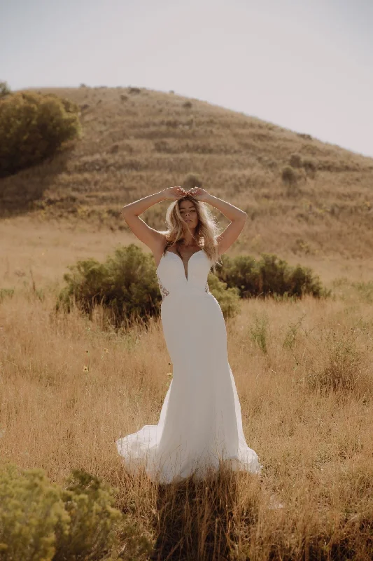 Plunging - neckline wedding dress for a bold lookD3339